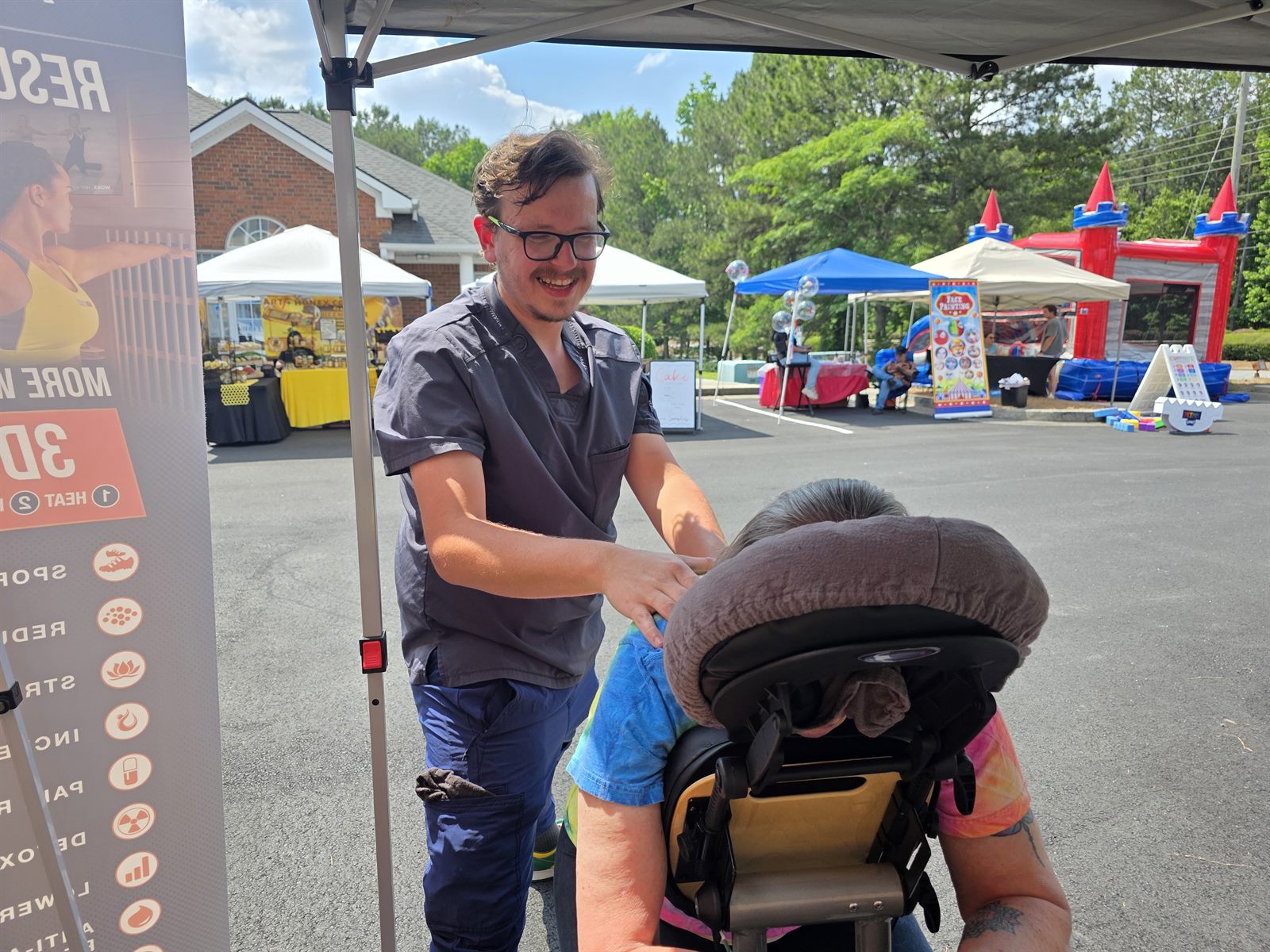 Chair massage under the tent at the Rock the Block Party